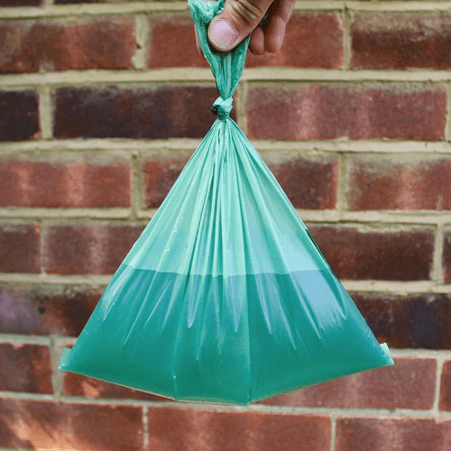 A dog poop bag filled with water