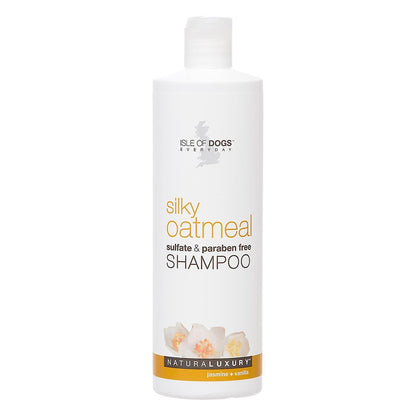 A white bottle of dog shampoo with white flowers on the bottle