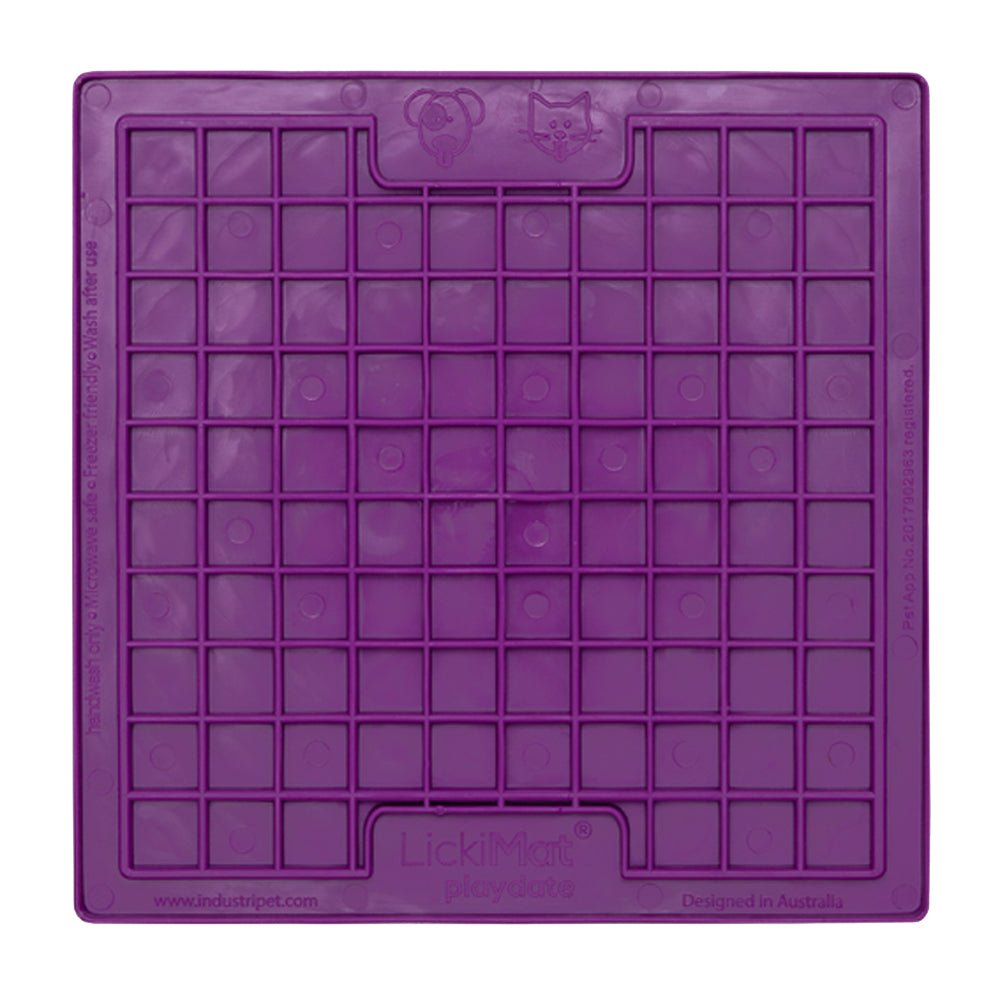 A purple square rubber mat that has small squares inside.