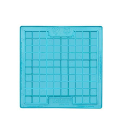A turquoise square rubber mat that has small squares inside.