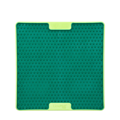 A green square hard case rubber mat with small numbs inside.