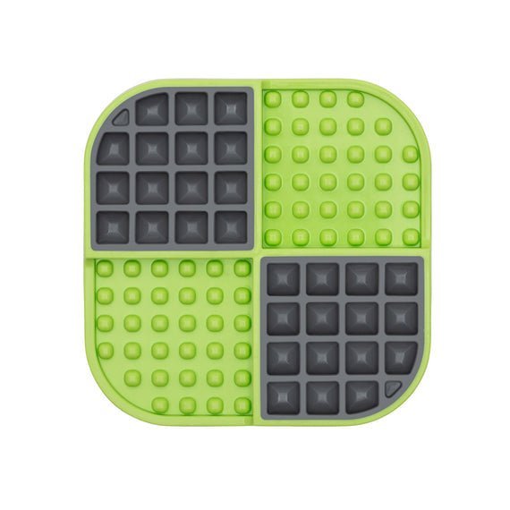 A green square hard case mat with numbs and squares inside.