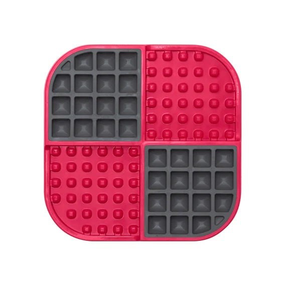 A red square hard case mat with numbs and squares inside.