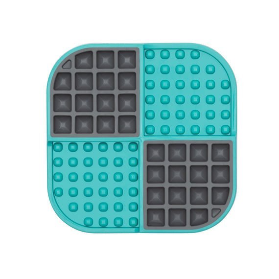 A turquoise square hard case mat with numbs and squares inside.