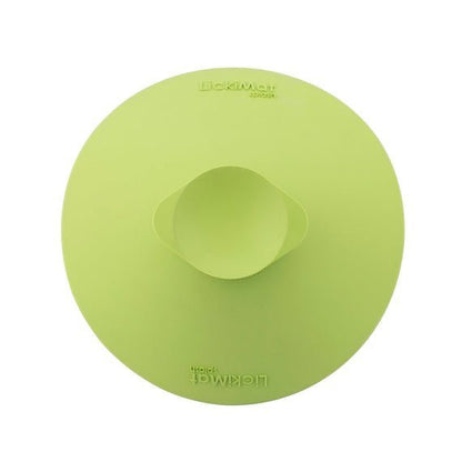 A green rubber bowl back with a suction cup at the back.