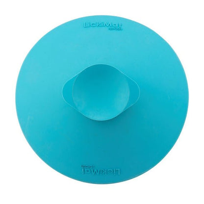 A turquoise rubber bowl back with a suction cup at the back.