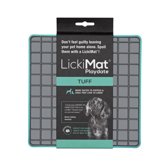 A turquoise square hard case rubber mat with squares inside and a packing band around the LickiMat.