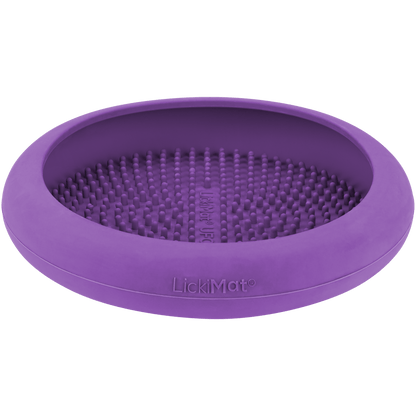 A purple rubber bowl with numbs inside.