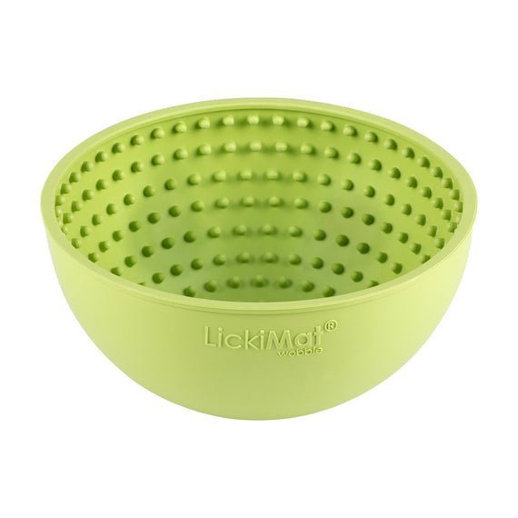 A green rubber bowl with small nubs inside.