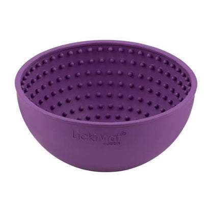A purple rubber bowl with small nubs inside.