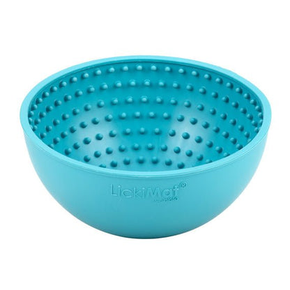 A turquoise rubber bowl with small nubs inside.