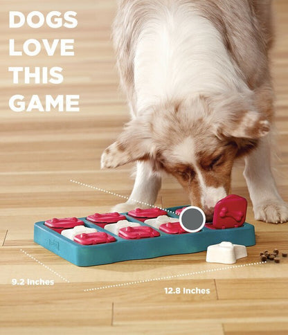 A dog searching for treats in a square dog treat puzzle with red and white bricks that cover slots in the treat puzzle